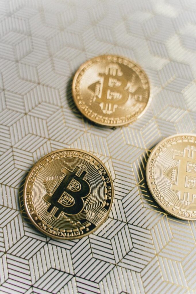 cryptocurrency vs traditional investment diversification bitcoins Close-up image of golden Bitcoins.
