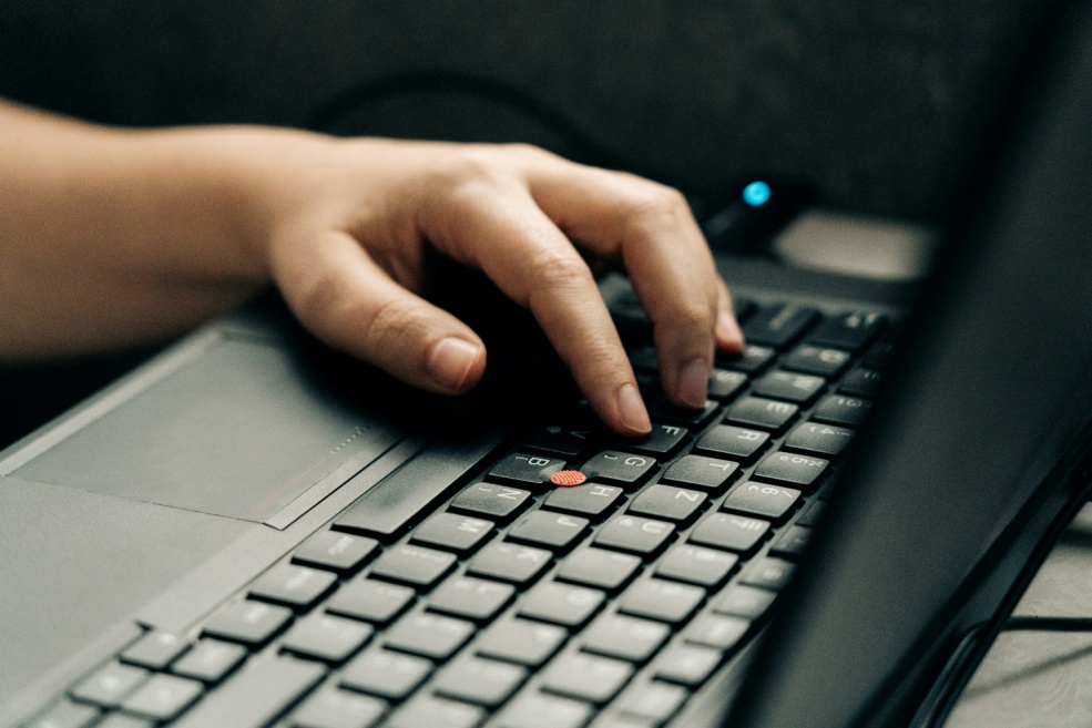 digital fund governance Person analyzing data on a laptop